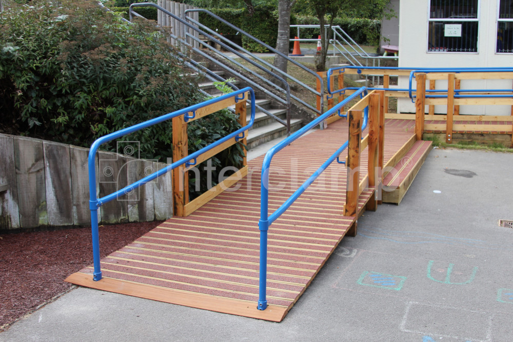 Handrail constructed with Interclamp key clamp DDA Assist fittings at a school, ensuring compliance with accessibility standards and providing secure support for students.